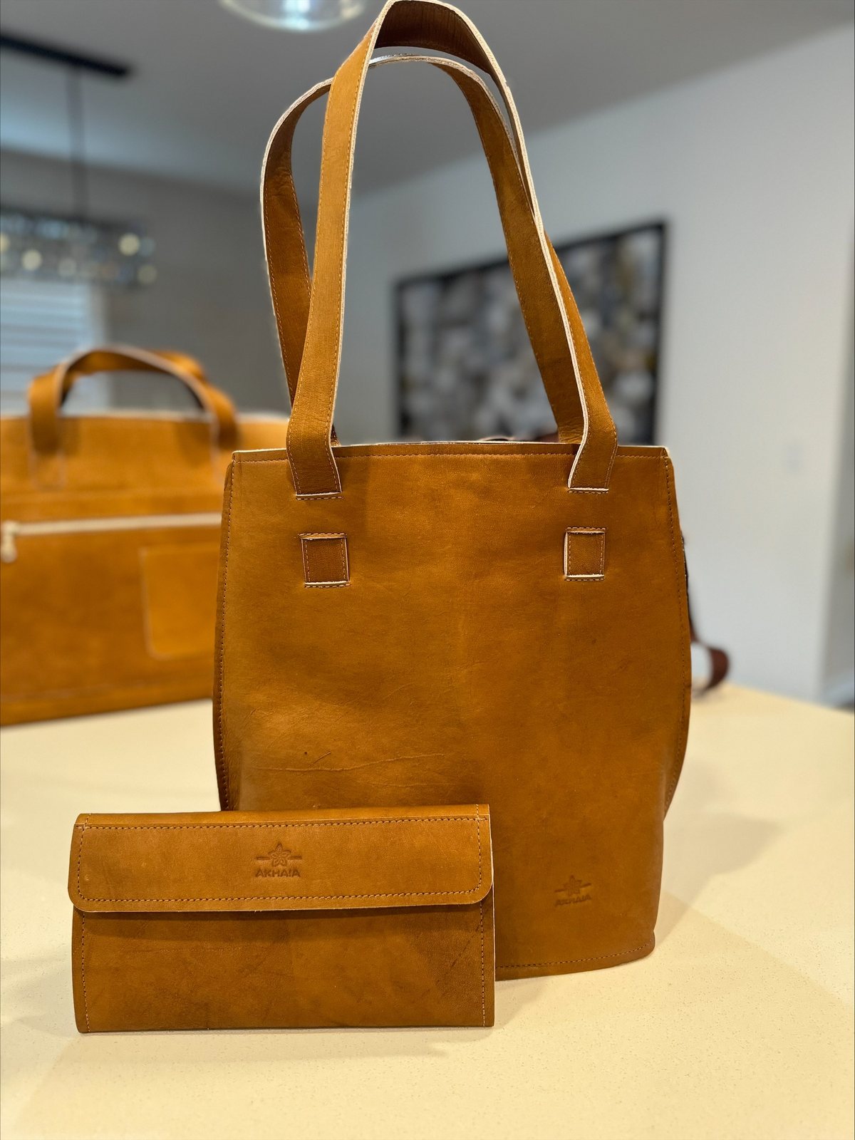 Antigua Shoulder Bag — Tall tan shoulder bag with long straps