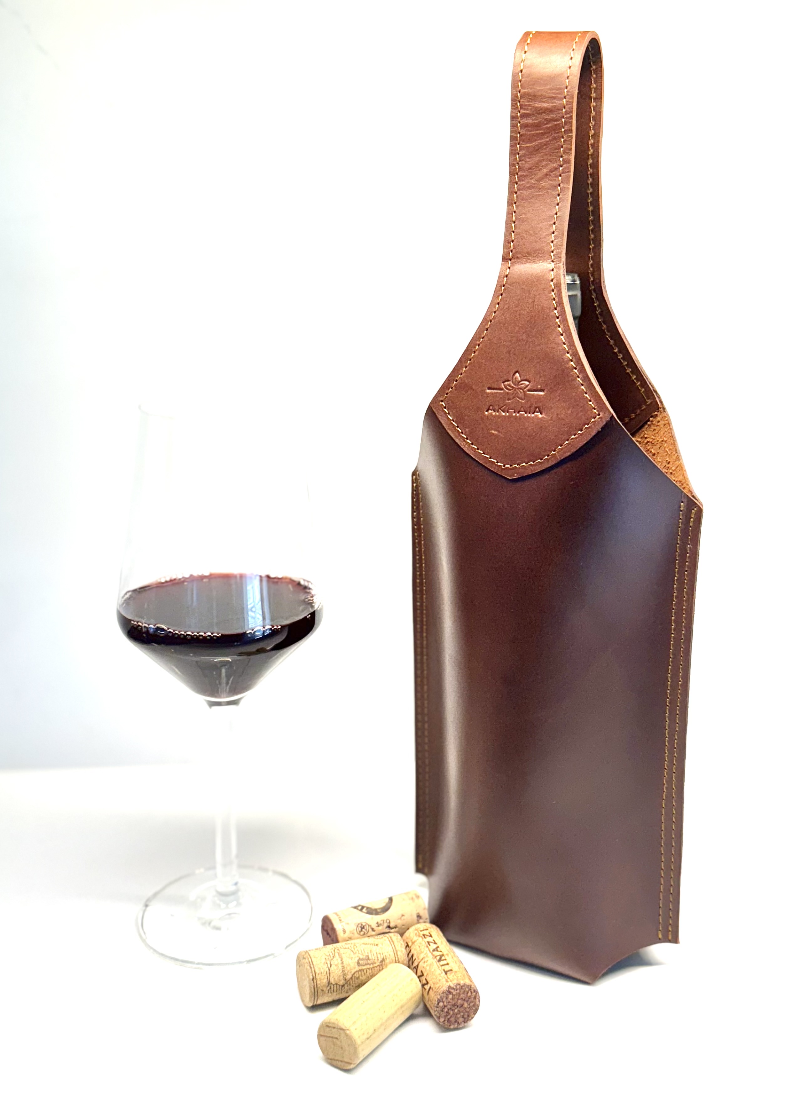 Leather Wine Holder — Holds one bottle. Leather, with a handle